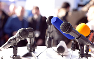 cluster of microphones for an announcement